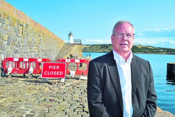 John Cox at Banff Harbour when the pier was closed off due to damage