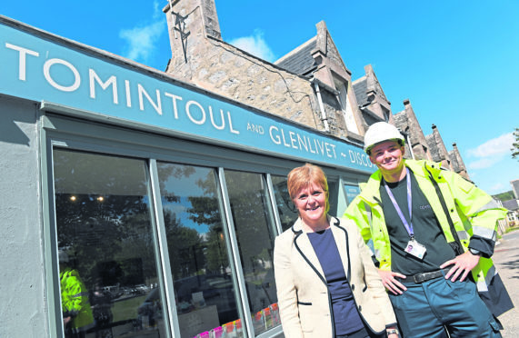 On the day where the First Minister Nicola Sturgeon announced 25,000 more than planned homes and businesses in the Highlands and Islands will be able to access superfast broadband through the digital Scotland roll out, she visited a museum in Moray, the Tomintoul and Glenlivit Discovery Centre, where she is pictured with Openreach Network Engineer Sean Chalmers.   
Picture by Kami Thomson