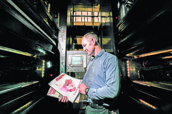DC Thomson production manager Craig Bertie examines The Menu and Your Life pull-outs, part of the new Press and Journal