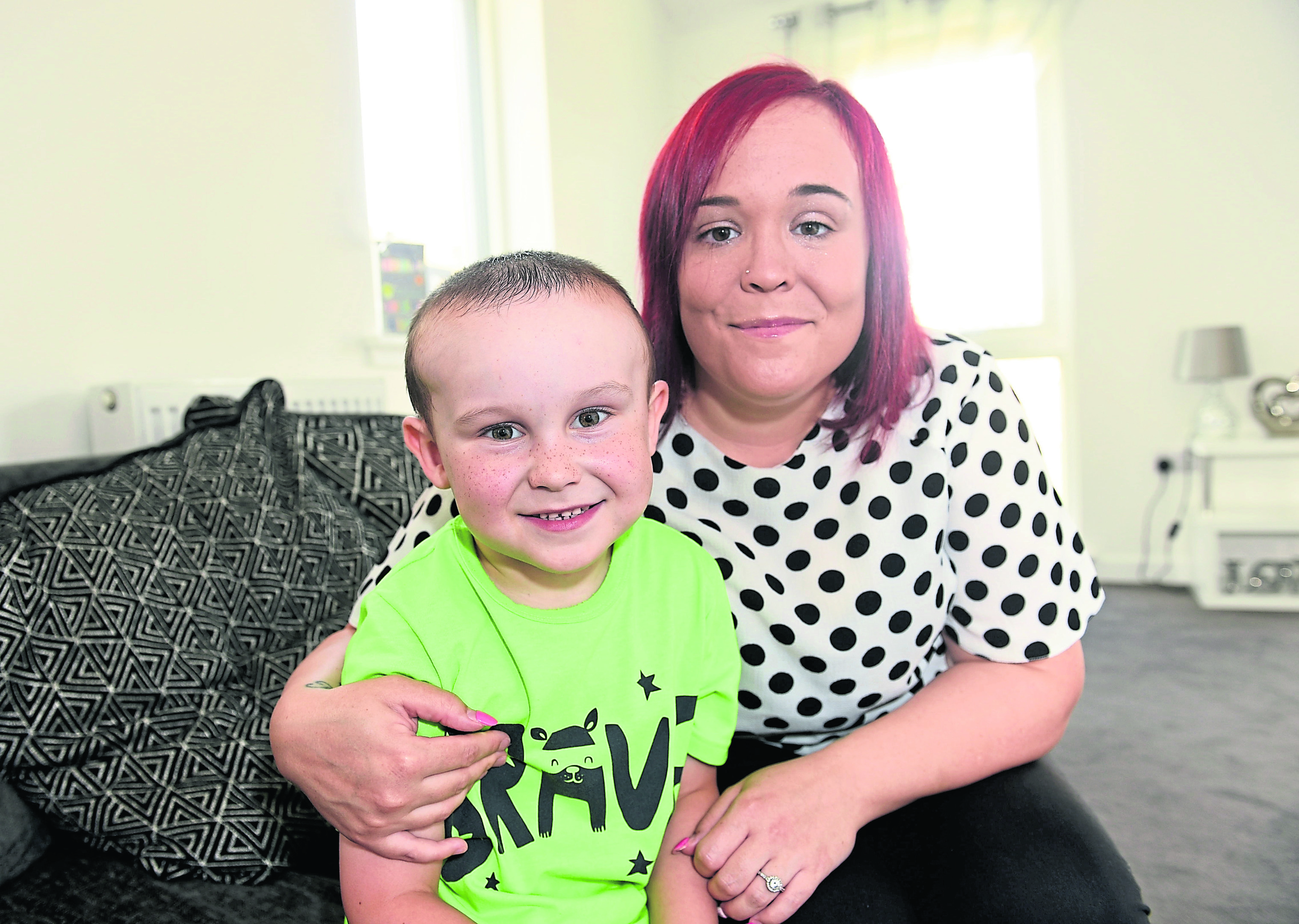 Pictured are Kyle Judge, 5 and his mum Claire Hadden. Kyle fell out of a window in February. He was airlifted to hospital in Glasgow where he had half of the bones in his brain removed. He will be getting a major operation in the future to rebuild this later in the year. Claire (his mum) has spoken about the difficulties he has faced since then. 
Picture by Darrell Benns