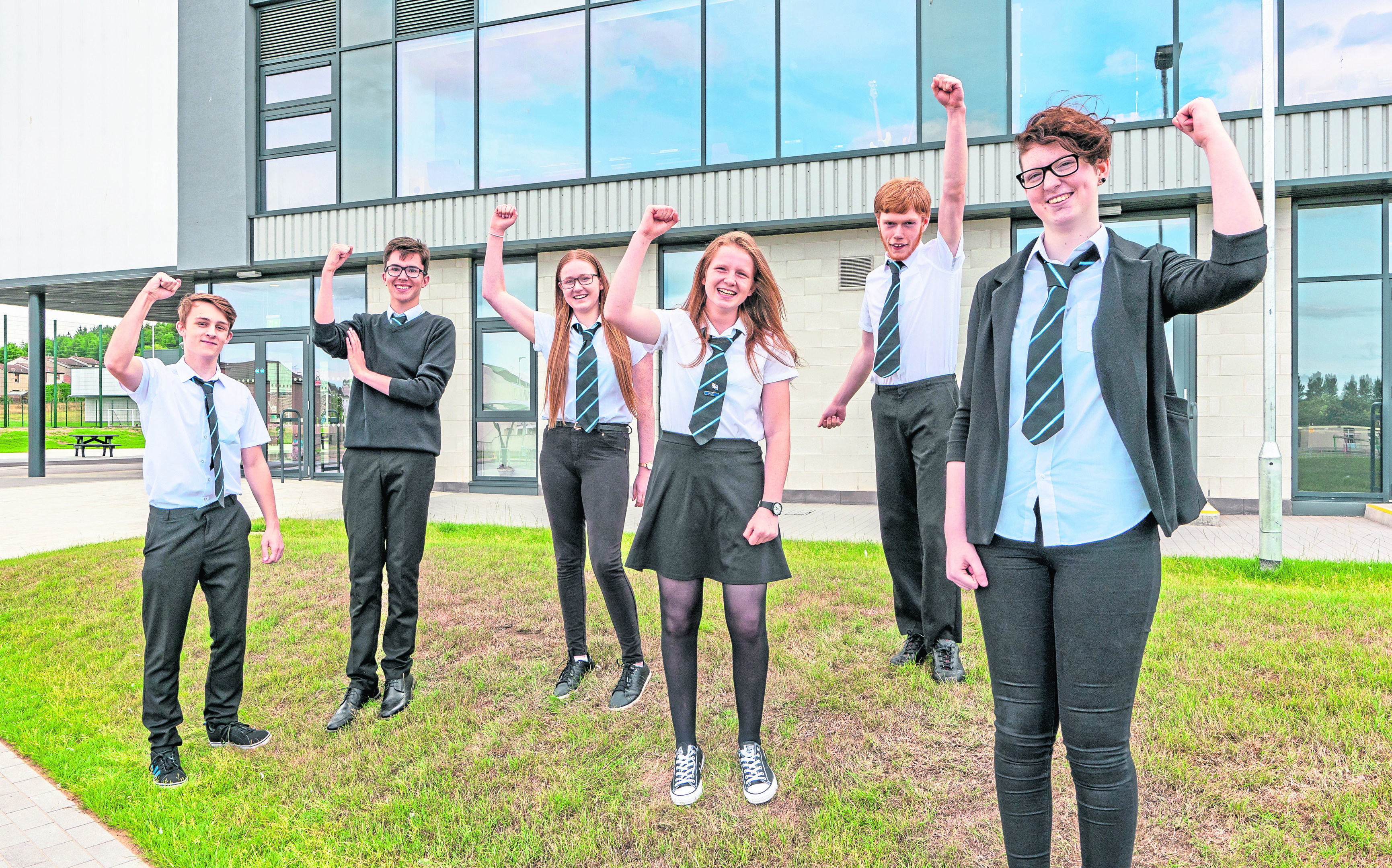L-R - Angus Little, Stewart Ewen,, Emily Sutherland,, Eilidh Stewart, Andrew McIntyre and Morgan McRitchie at Elgin High School all jumping for joy at passing their exams.