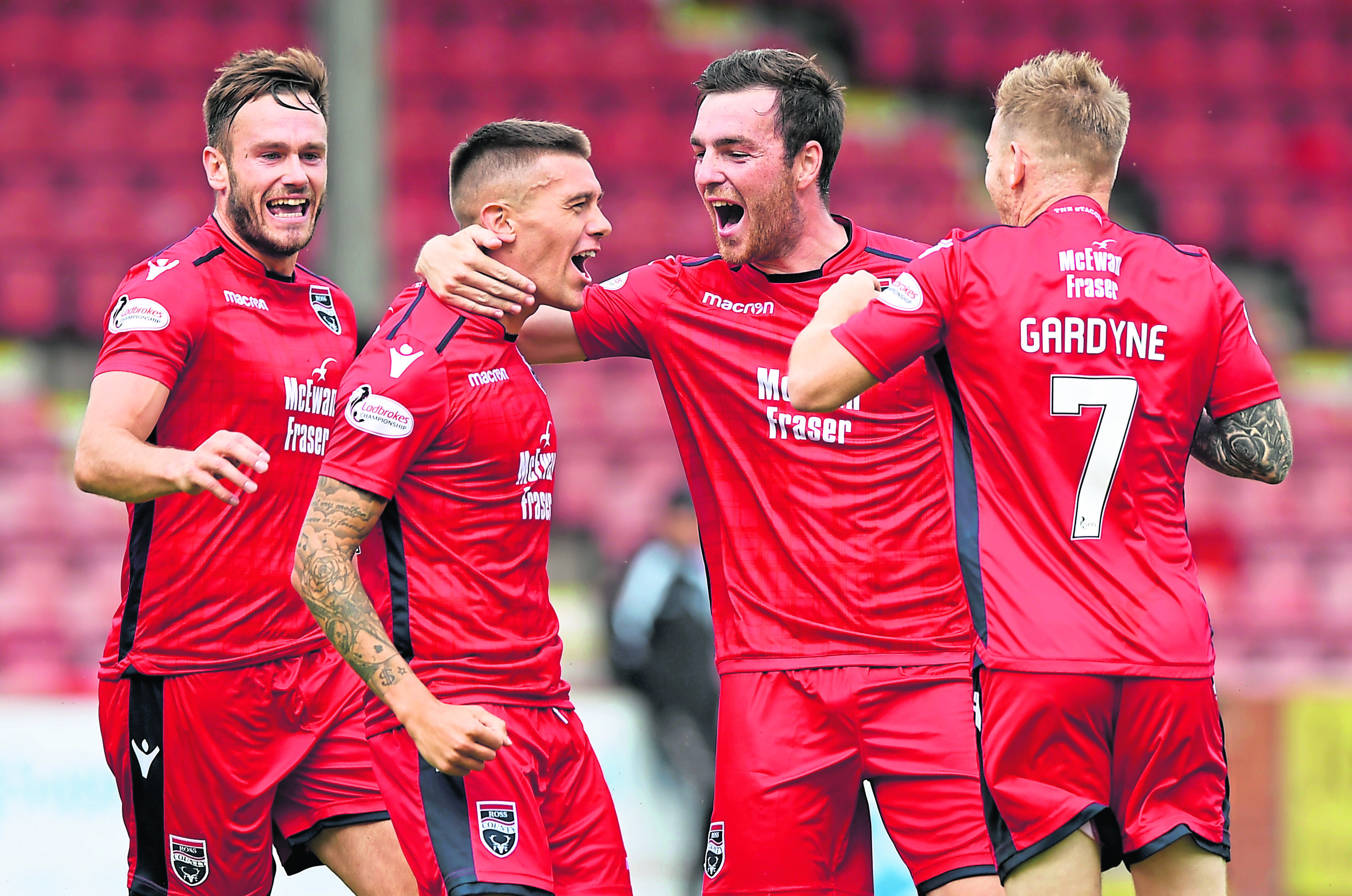 Ross County's Josh Mullin (second from left) celebrates his opening goal.