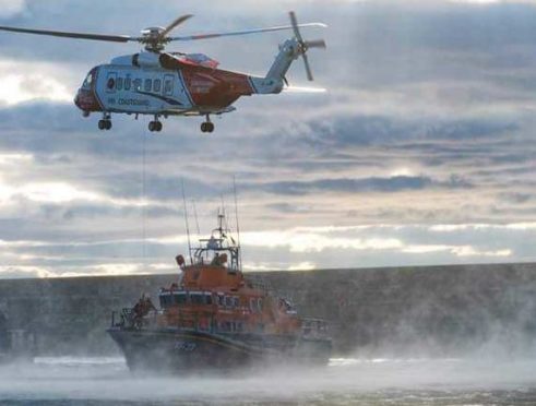 HM Coastguard helicopter and RNLI lifeboat