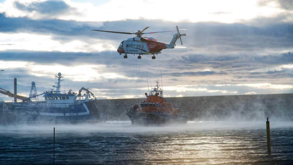 Coastguard and lifeboat teams were sent to Buckie Harbour. Picture: John Duncan.