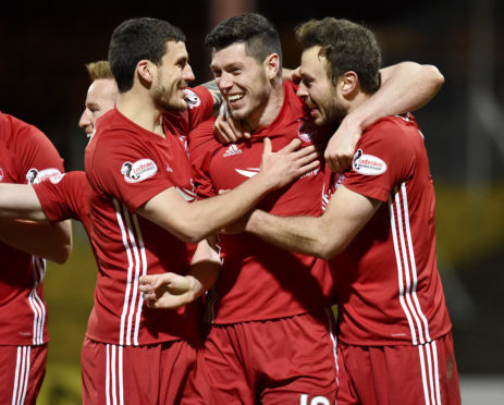 Andrew Considine (right) rates Scott McKenna as one of the best he has played with.