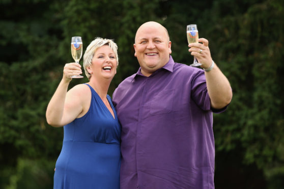 Gillian Bayford celebrating winning the jackpot in 2012 with then-husband Adrian.