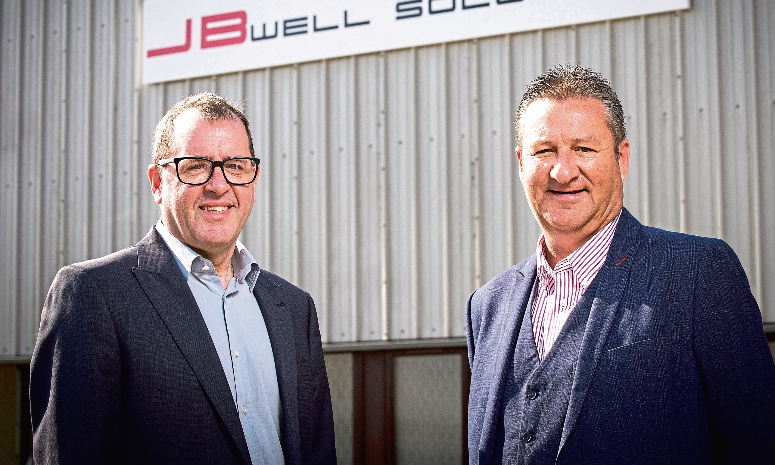 Local businessmen Robbie Garden, left, and Robbie Gray outside the JB Well Solutions headquarters