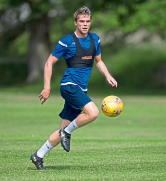 Ross County skipper Marcus Fraser is back in action.