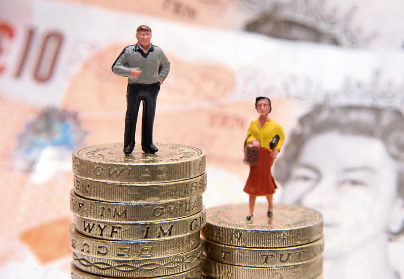 File photo dated 27/01/15 of plastic models of a man and woman standing on a pile of coins and bank notes, as around half of companies required to submit their gender pay gap figures to the Government have yet to do so, with a week until the deadline. PRESS ASSOCIATION Photo. Issue date: Wednesday March 28, 2018. By April 4 an estimated 9,000 companies and public bodies with 250 employees or more have to have submitted their median and mean gender pay gap data to the Government Equalities Office. See PA story INDUSTRY GenderPay. Photo credit should read: Joe Giddens/PA Wire