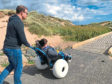 Ben Henry tries out the new Hippocampe wheelchair at Balmedie beach with father Gavin.
Submitted