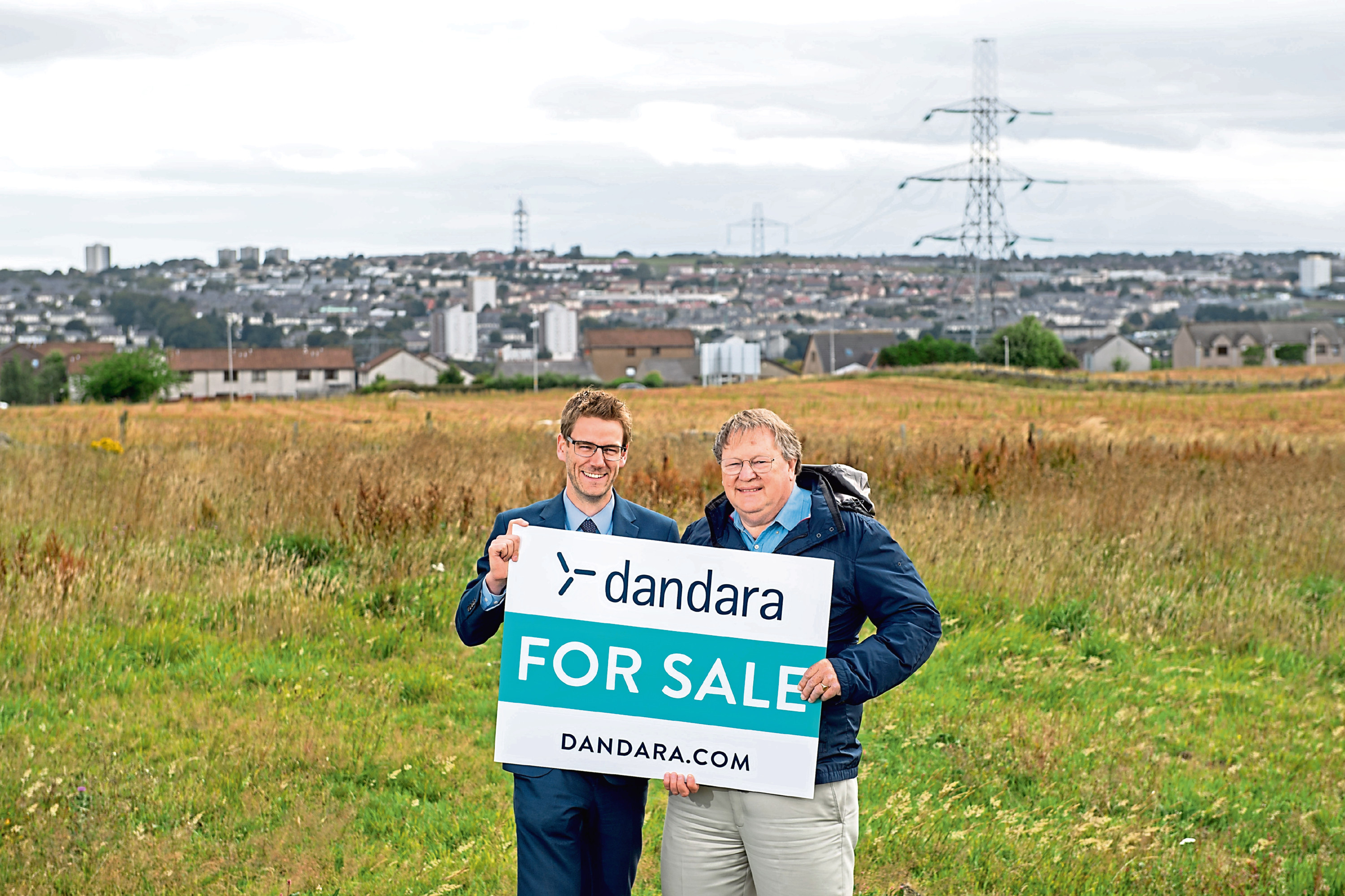 Peter Best, left sales director for Dandara, and Bruce Smith, for the Grandhome Trust, at  the Grandhome Whitestripes site.