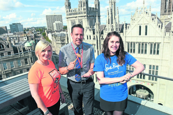 Pictured from left, Lynn Batham from Charlie House, Neil Simpson and Emma Leiper-Finlayson, Sue Ryder.