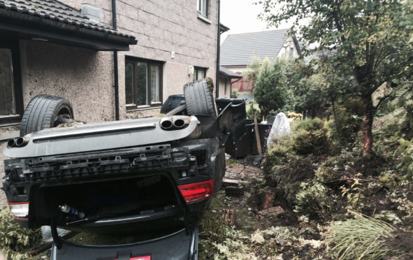 The scene of a crash where an Audi S5 crashed off the A90 southbound into the back of a house on St Ternans Road in Newtonhill.