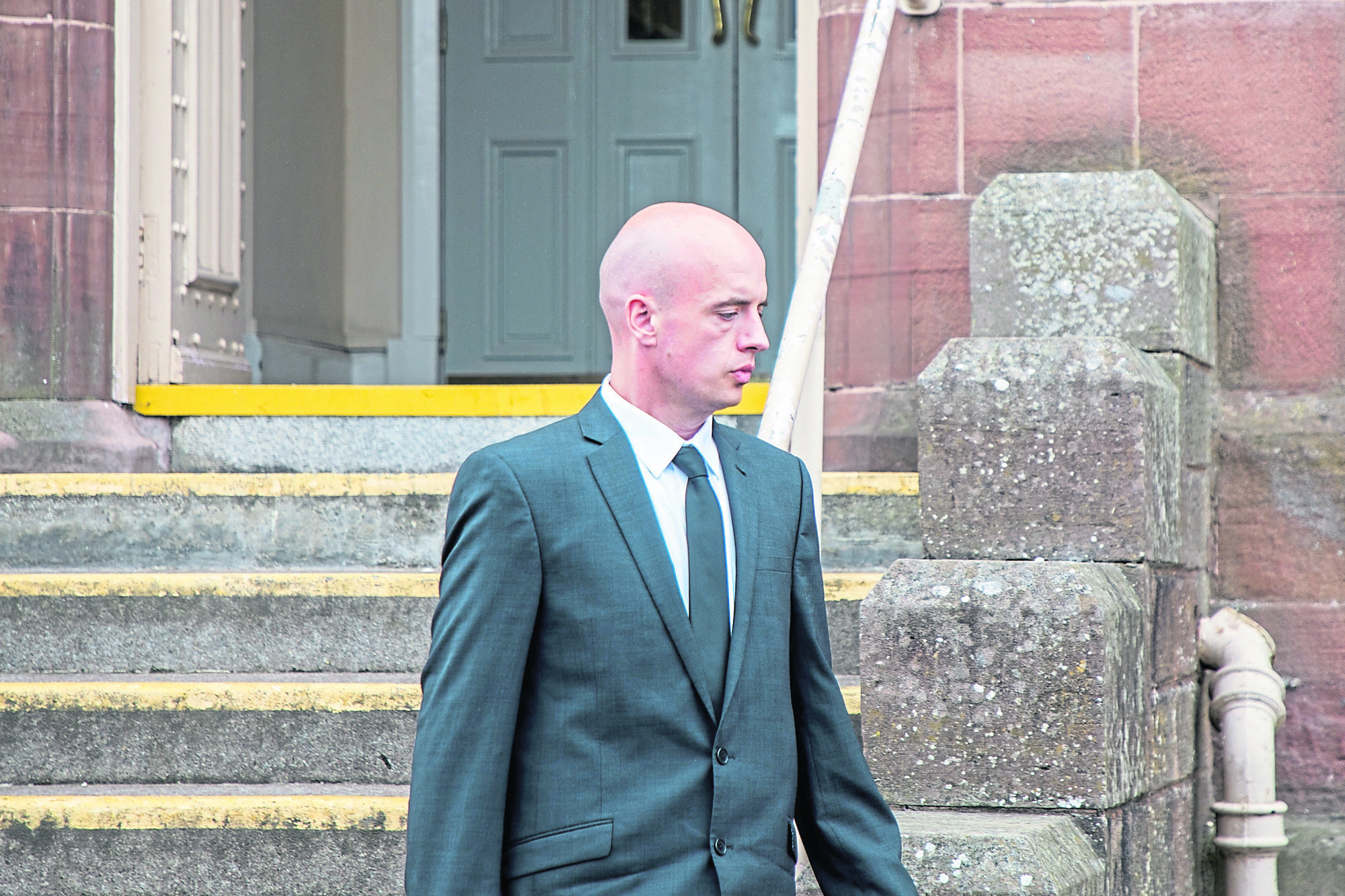 Sean York leaves Inverness Sheriff Court at the start of his trial