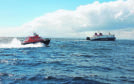 MV Loch Seaforth being escorted to Stornoway by a lifeboat