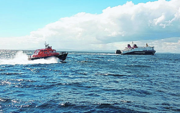 MV Loch Seaforth being escorted to Stornoway by a lifeboat