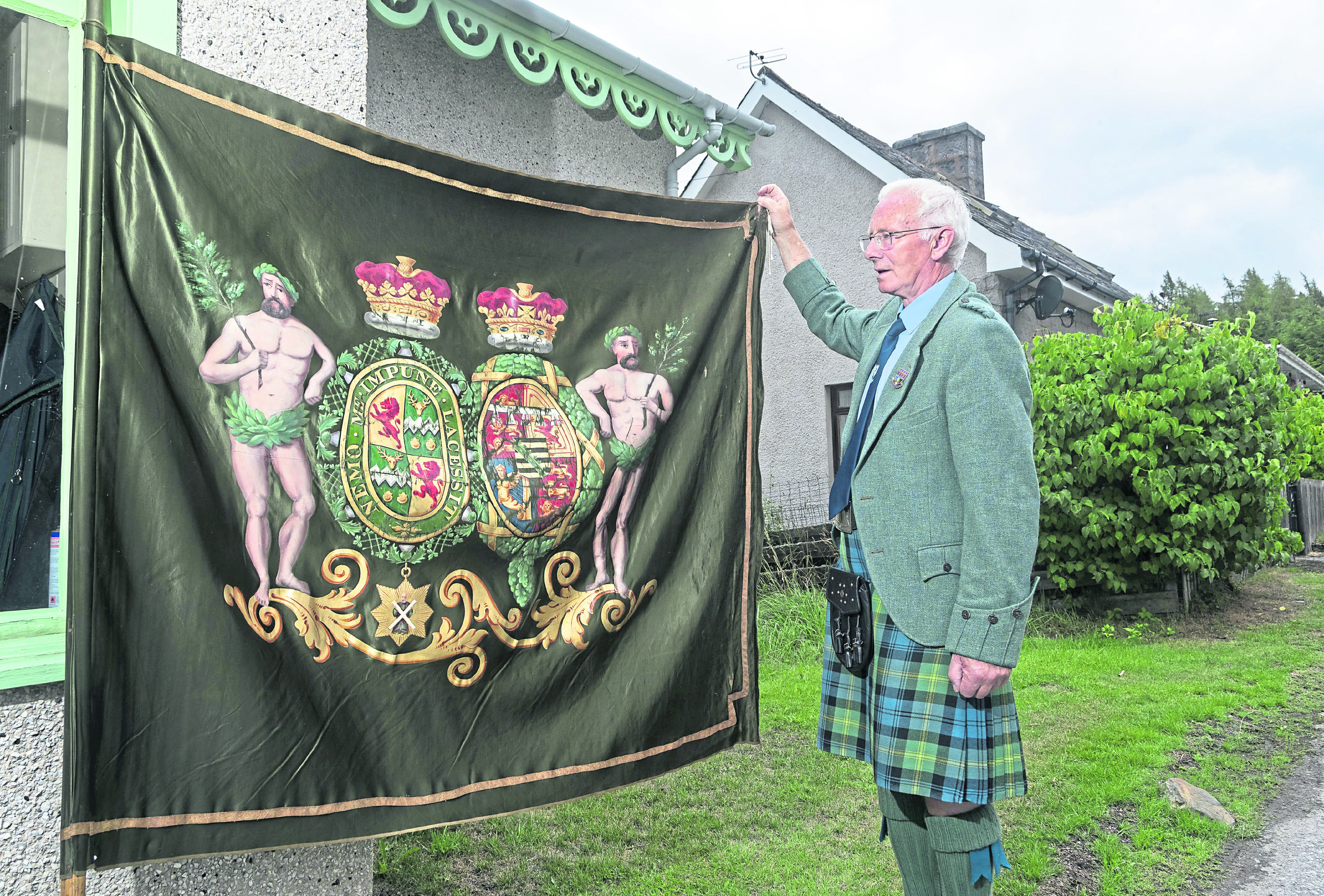 The Duff Highlanders banner, held by David Geddes.