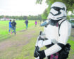 Stormtrooper Dan Gillespie of Aberdeen keeps an eye on park runners close to the Inverness Ice Arena.
