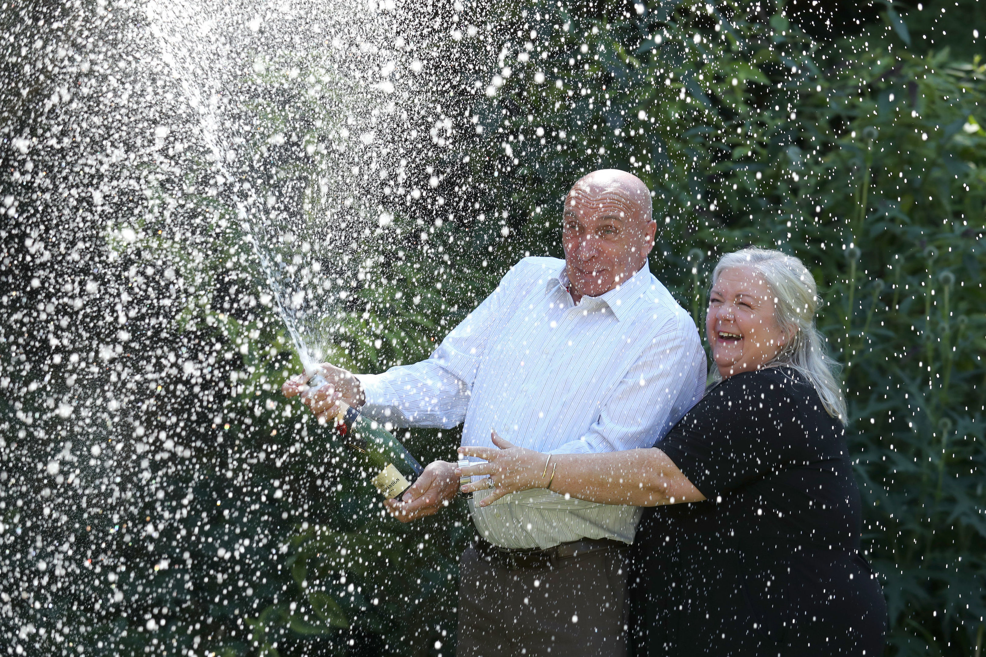 Fred and Lesley Higgins from Laurencekirk celebrate their £58m EuroMillions lottery win.
