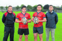 Aberdeen Grammar coach Ali O’Connor, left, with, from left, Sam Knudson, club captain                                             Doug Russell and team manager Christian Brew. Picture by Kenny Elrick.