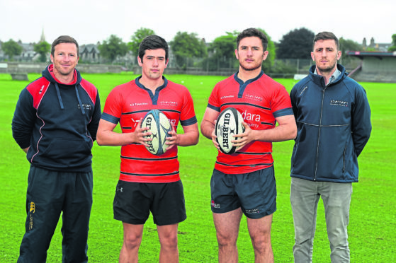 Aberdeen Grammar coach Ali O’Connor, left, with, from left, Sam Knudson, club captain                                             Doug Russell and team manager Christian Brew. Picture by Kenny Elrick.