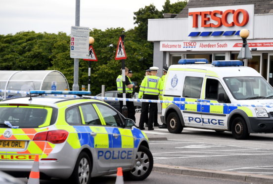 Officers from Police Scotland at Tesco, Wellington Road, Torry, where a pedestrian was knocked down.    
Picture by Kami Thomson    13-08-18
