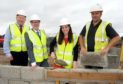 Kate Forbes MSP and Housing Minister Kevin Stewart visited the affordable homes project in Kyleakin last August - which has just been completed