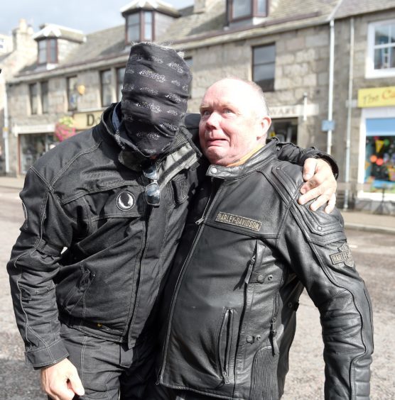 Gordon Cameron, of Perth, gets a fright from one of his fellow bikers on Grantown High Street.