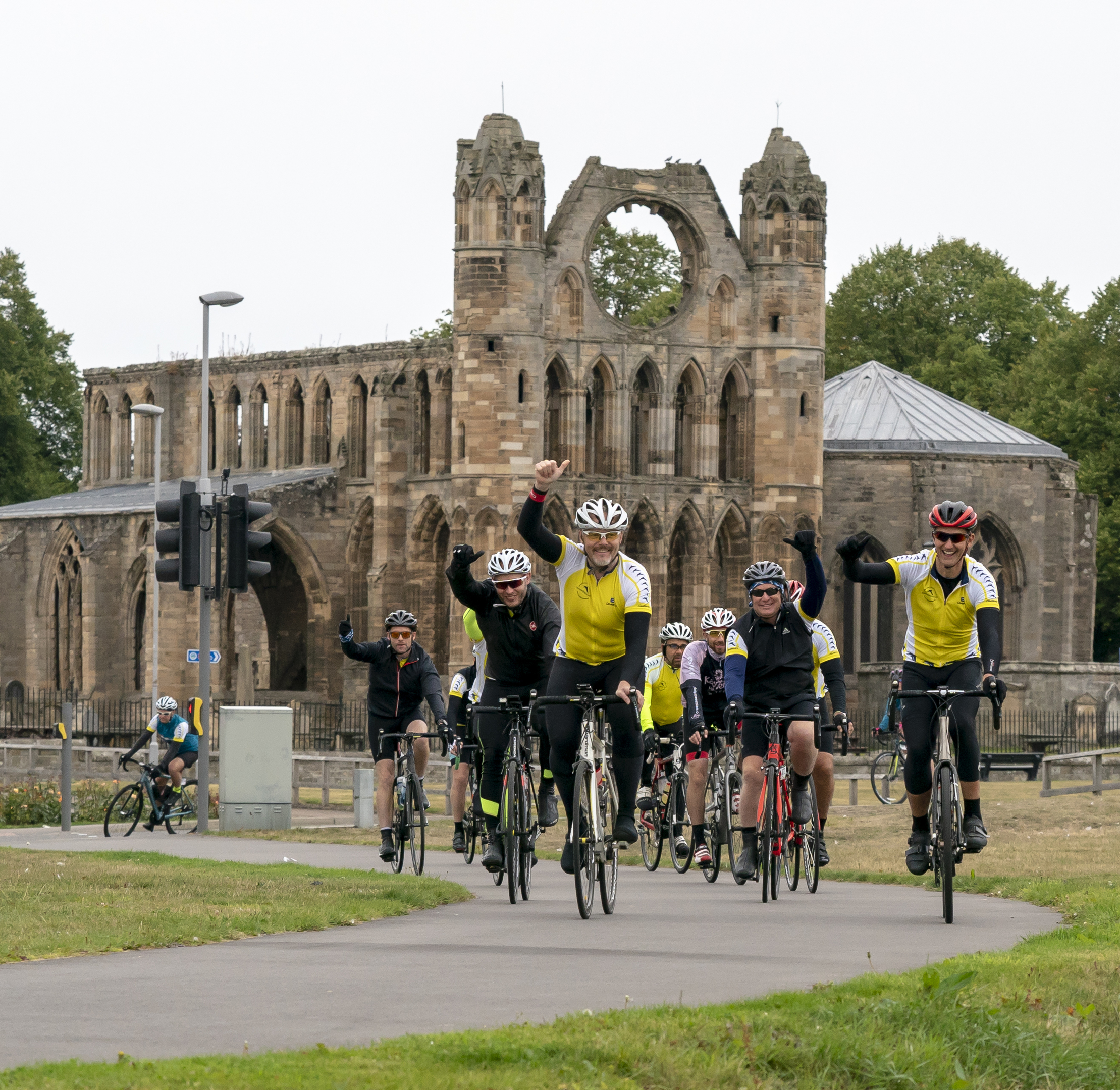 Ride the North cyclists passing Elgin Cathedral.