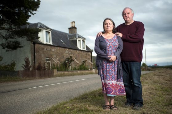 Gaynor and Tim Barry outside their home near Macallan's distillery.