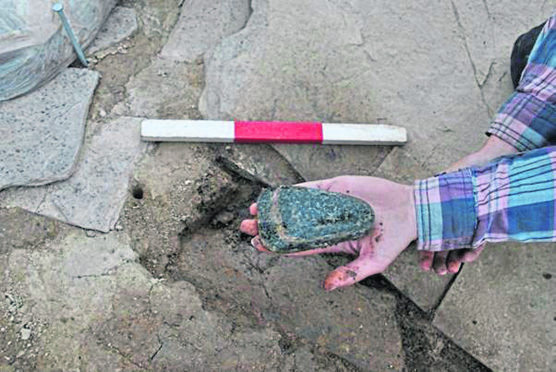 The second stone axe showing the natural banding in the rock