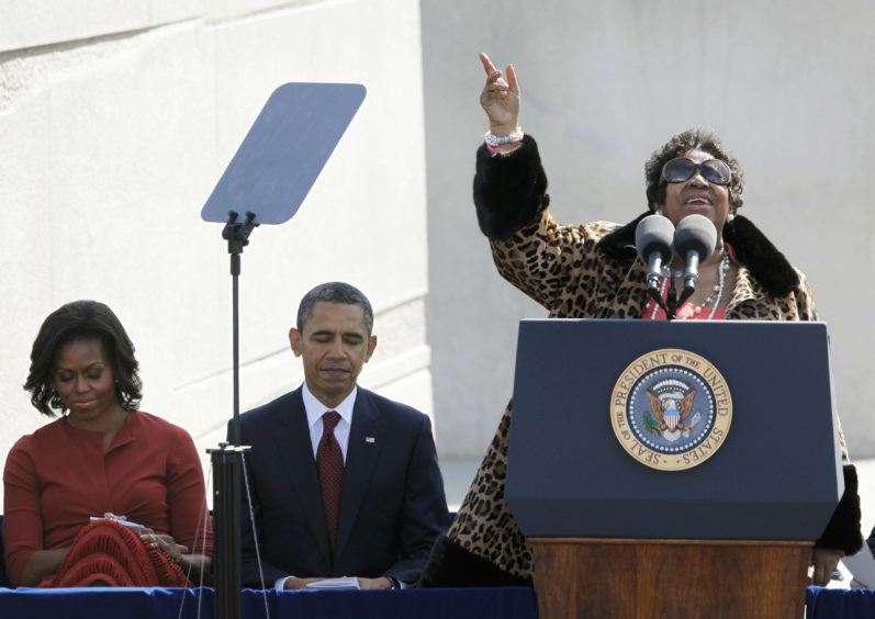 Aretha Franklin sings before President Barack Obama speaks during the dedication of the Martin Luther King Jr. Memorial in Washington. (AP Photo/Charles Dharapak)