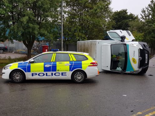 A van was left on its side after the two-vehicle crash on Greenbank Road.