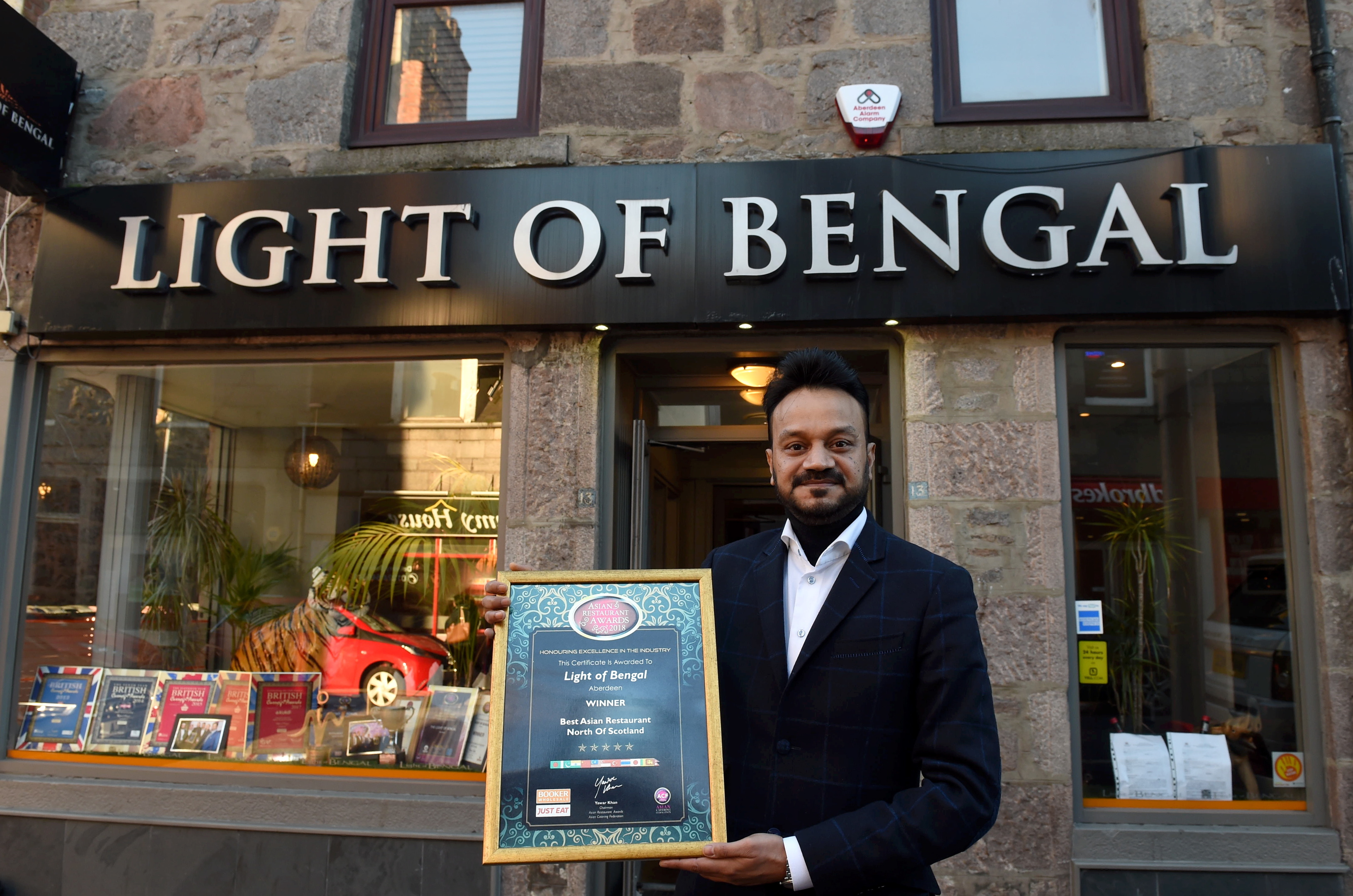 Pictured is Noor Ahmed with his award at the Light of Bengal, Rose Street, Aberdeen.
Light of Bengal has picked up the first prize in Manchester at the Asian Curry Awards  Best Restaurant In Scotland. It is also the restaurants 40th anniversary this year. 
Picture by DARRELL BENNS    
Pictured on 09/03/2018