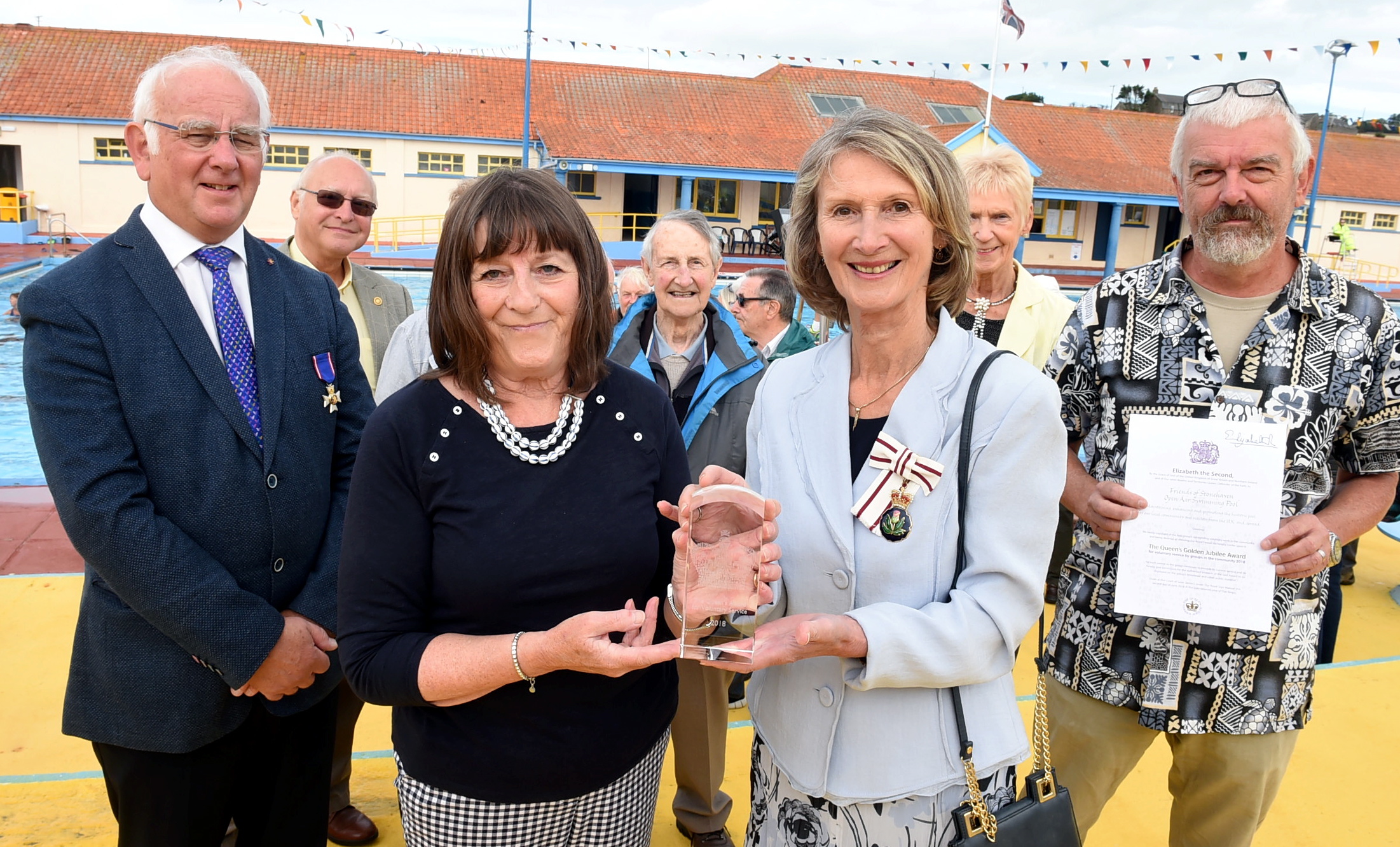 The lord lieutenant of Kincardinshire, Carol Kinghorn, handed over the Queen's award for voluntary service to the Friends of Stonehaven open air swimming pool. In the picture are from left: Gordon Ritchie, Kate Bain, Carol Kinghorn, lord lieutenant of Kincardineshire and Pete Hill, chairman. 
Picture by Jim Irvine