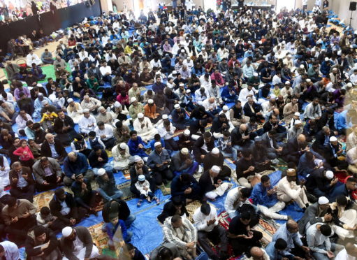 The Aberdeen Mosque and Islamic centre, celebrate the Eid in the Garden at Aberdeen Leisure centre, Aberdeen. In the picture they are at prayer. 
Picture by Jim Irvine.