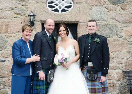 Wendy Anderson (pictured far left) at her daughter's wedding in 2016