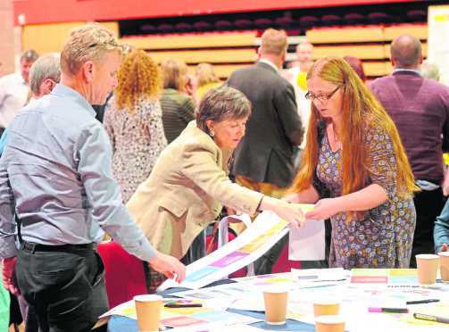 The planning workshop held in the Nevis Centre, Fort William yesterday. Delegates take part in the round table and discussion sessions.
Picture by Sandy McCook.