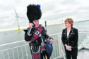 First Minister Nicola Sturgeon officially opened the Vattenfall's 93.2MW facility in Aberdeen. She is with piper Norman Fiddes,
Picture by COLIN RENNIE    September 7, 2018.