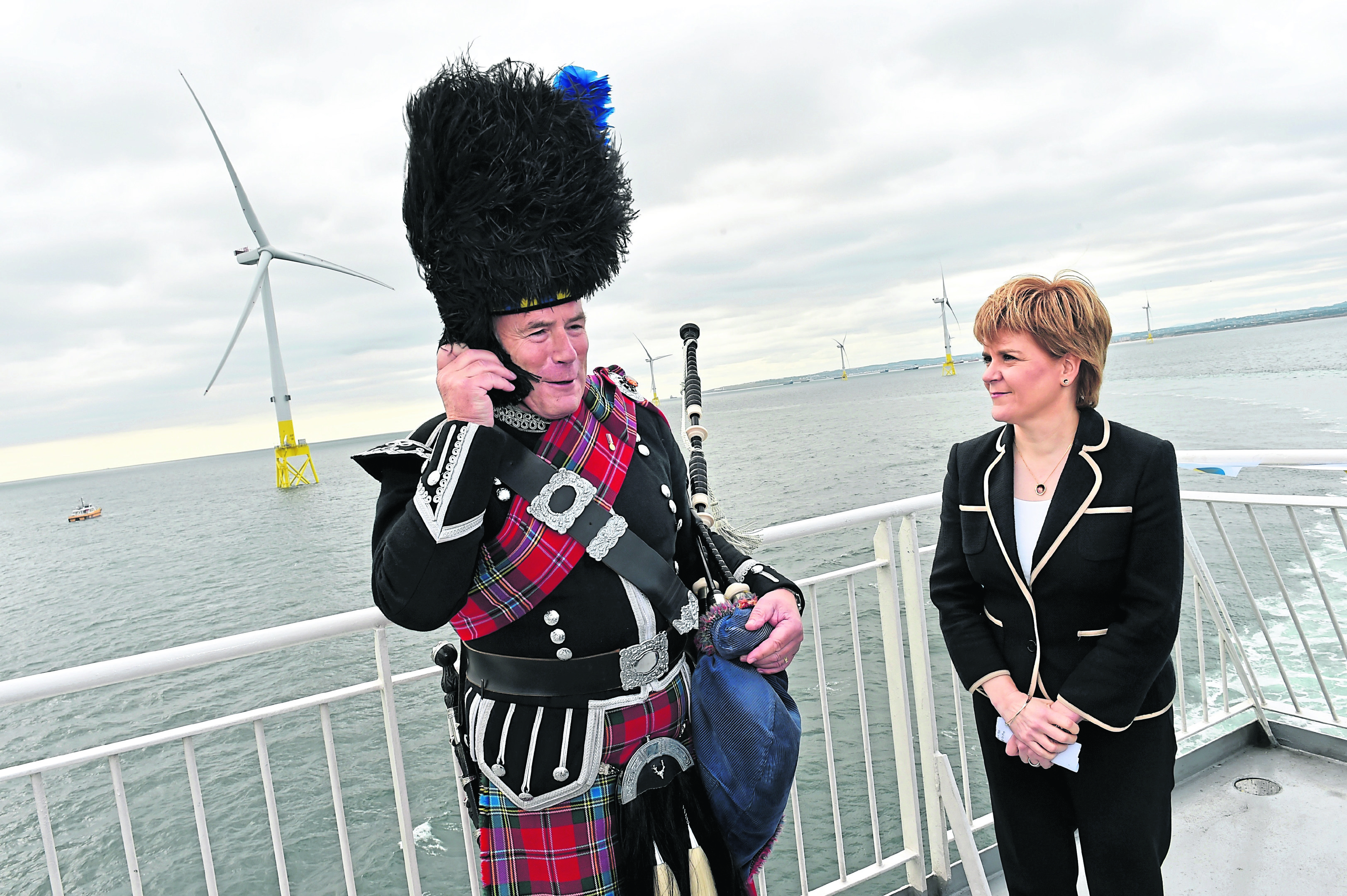 First Minister Nicola Sturgeon officially opened the Vattenfall's 93.2MW facility in Aberdeen. She is with piper Norman Fiddes,
Picture by COLIN RENNIE    September 7, 2018.