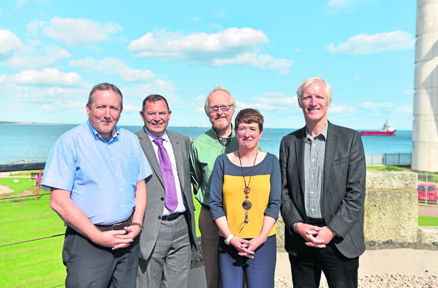 The five original members of Aberdeen Renewable Energy Group, seen recently at Aberdeen beach, are David Roger, John Black, Jeremy Cresswell, Morag McCorkindale, and Iain Todd