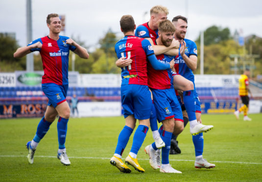 Inverness celebrate their second goal, scored by Shaun Rooney.