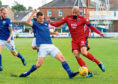 15/09/18 LADBROKES CHAMPIONSHIP 
 QOTS v ROSS COUNTY (0-0) 
 PALMERSTON PARK - DUMFRIES 
 Ross County's Liam Fontaine (right) holds off QOTS' Kyle Jacobs