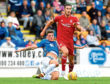 St Johnstone's Ross Callachan (L) in action against Aberdeen's Dominic Ball