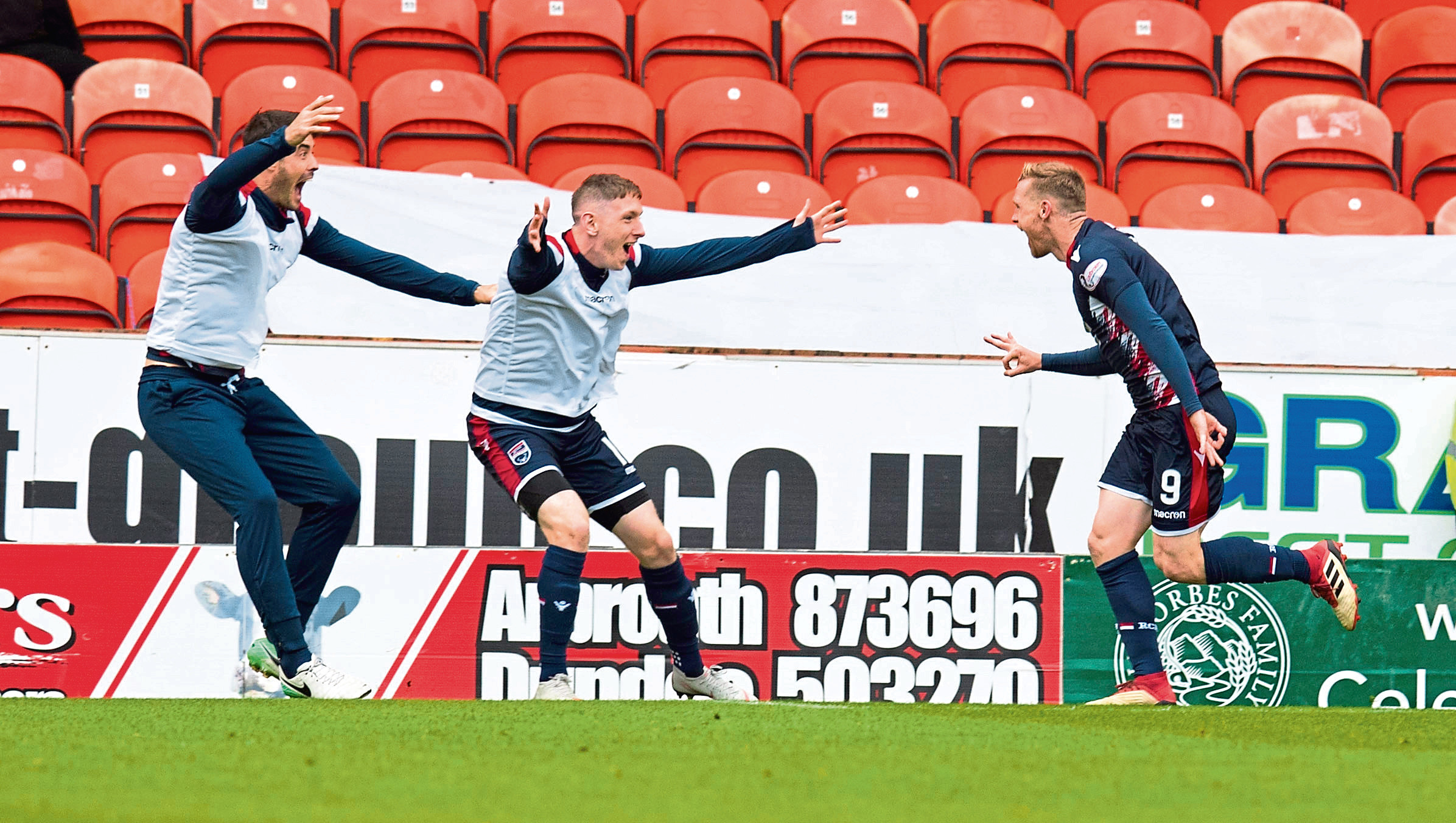 Ross County's Billy McKay (R) celebrates his third goal.