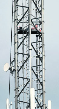 The accused mast climber on the platform 200 feet up the Mounteagle television and radio mast on the Black Ilse which triggered Tuesday's emergency.