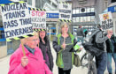 Protesters inside Inverness Station.