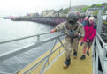 Diver Paul Guiver leaving the loch and heading towards Ben Nevis.