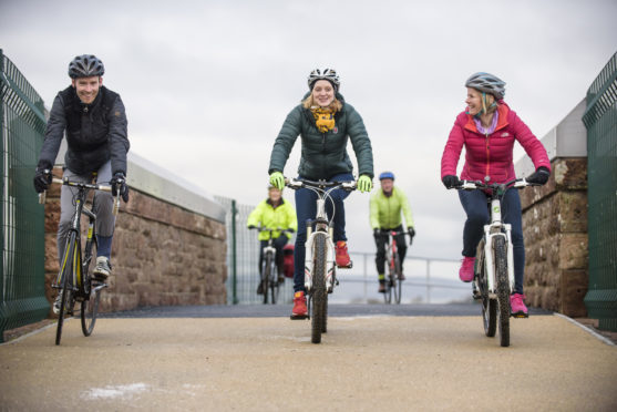 Cyclists cross the existing link on the Drumrosach Bridge which opened in 2016 linking the Inverness Campus and Inverness Retail Park.
