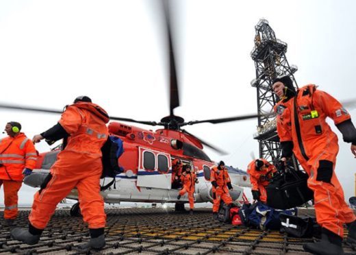 Offshore workers arrive on their platform by helicopter